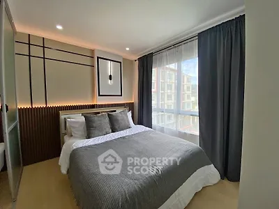 Modern bedroom with stylish decor and large window view
