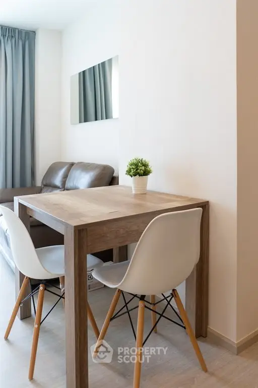 Modern minimalist living room with cozy seating and stylish dining area