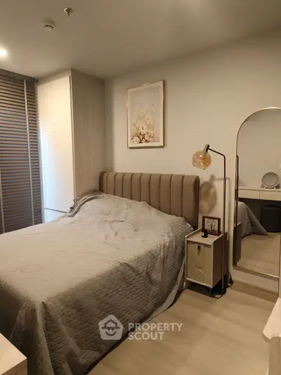 Cozy modern bedroom with stylish decor and elegant lighting