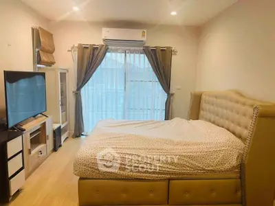 Cozy bedroom with elegant bed and large window for natural light