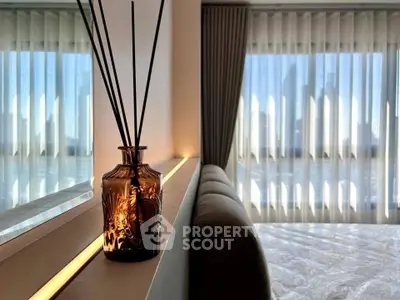 Modern bedroom with ambient lighting and large window view