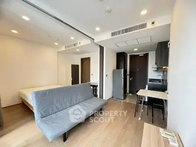 Modern studio apartment with open layout and sleek furnishings