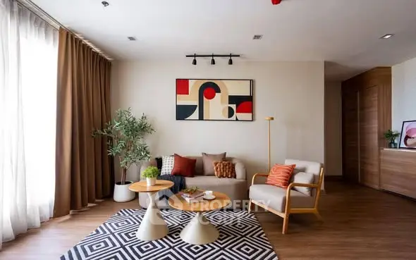 Stylish modern living room with abstract art and cozy seating area.