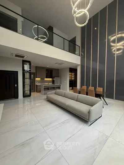 Luxurious modern living room with high ceilings and elegant lighting