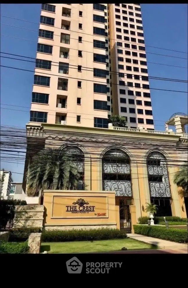 Stunning high-rise building exterior with elegant entrance and lush landscaping.