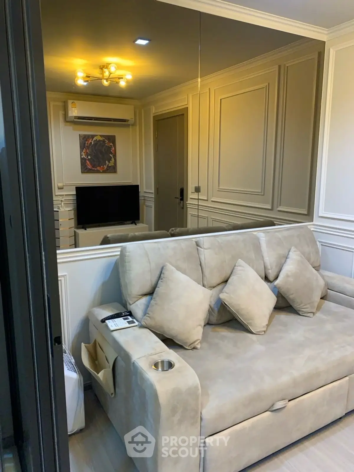 Cozy living room with elegant beige sofa and modern decor