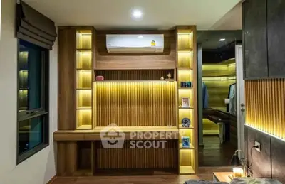 Modern bedroom with stylish wooden paneling and ambient lighting