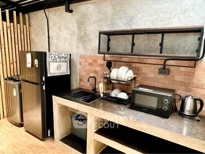 Modern kitchen with sleek appliances and stylish open shelving