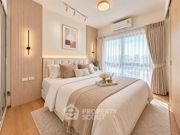 Luxurious bedroom with elegant decor and natural light, featuring a cozy bed and stylish furnishings.