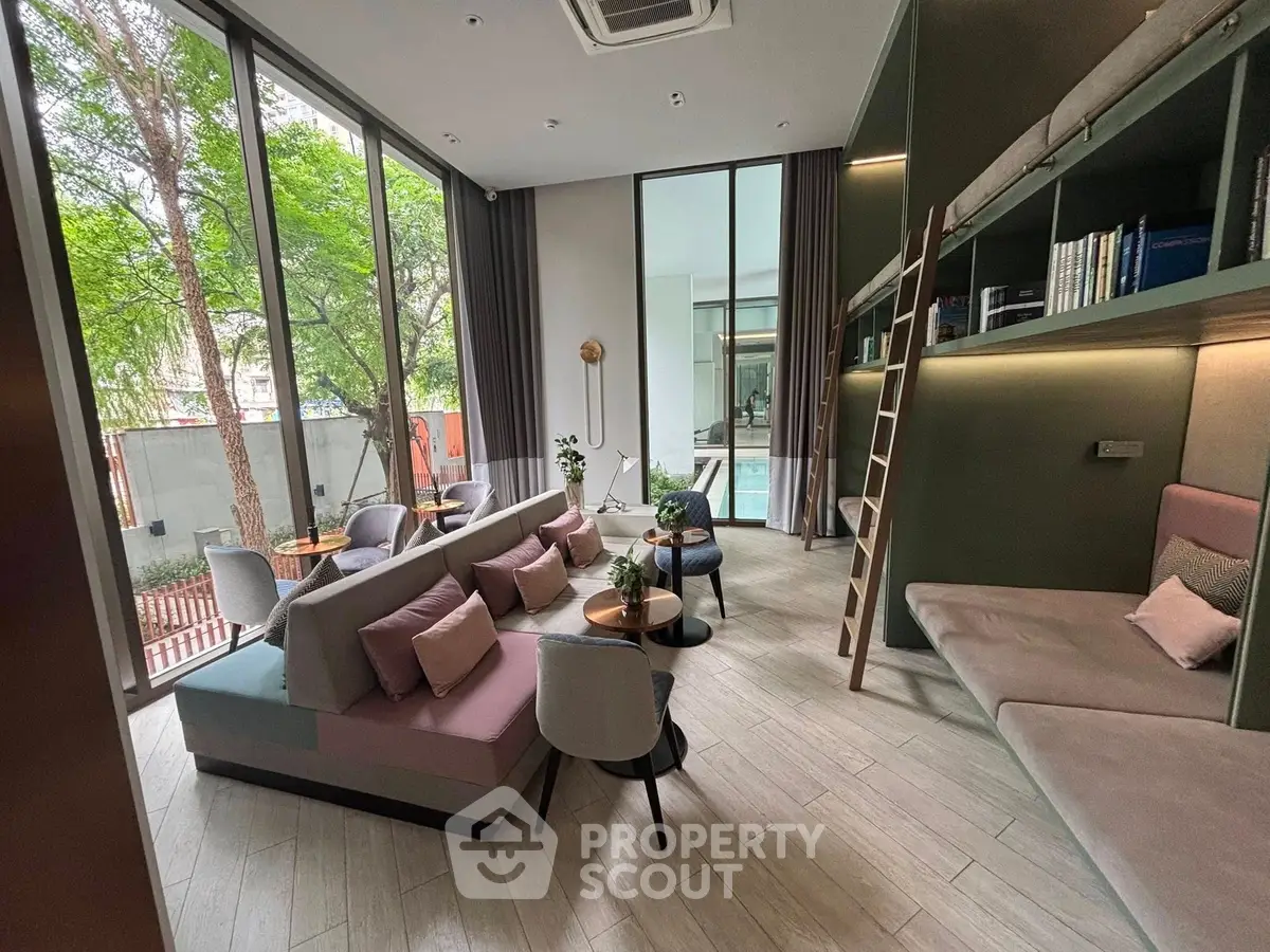 Modern living room with large windows and stylish furniture