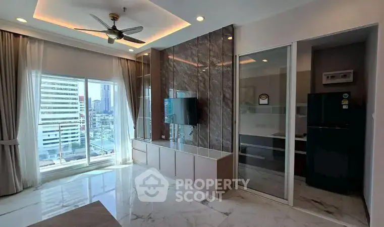 Modern living room with marble flooring, ceiling fan, and city view from large windows.