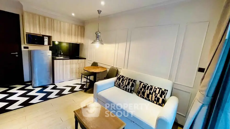 Chic modern living room with stylish kitchen and cozy seating area