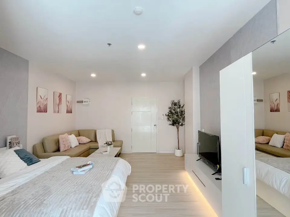 Spacious modern living room with cozy sofa and stylish decor