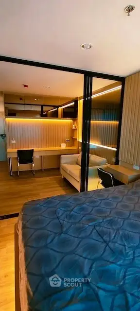 Modern bedroom with stylish study area and cozy lighting