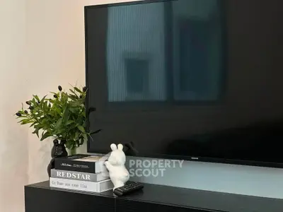 Modern living room with sleek TV setup and stylish decor