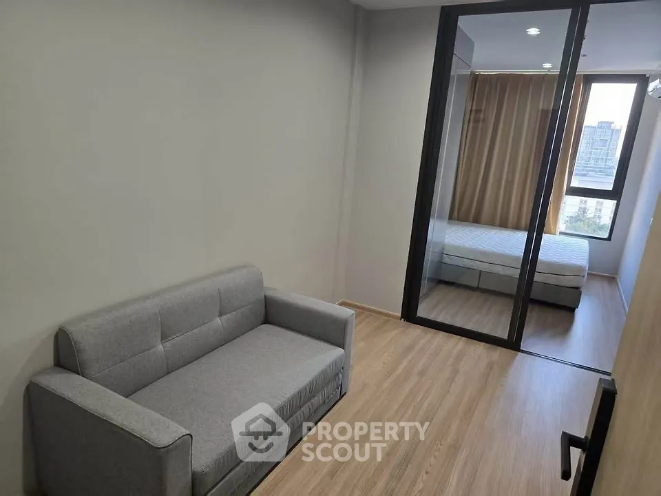 Modern apartment with cozy living room and bedroom view