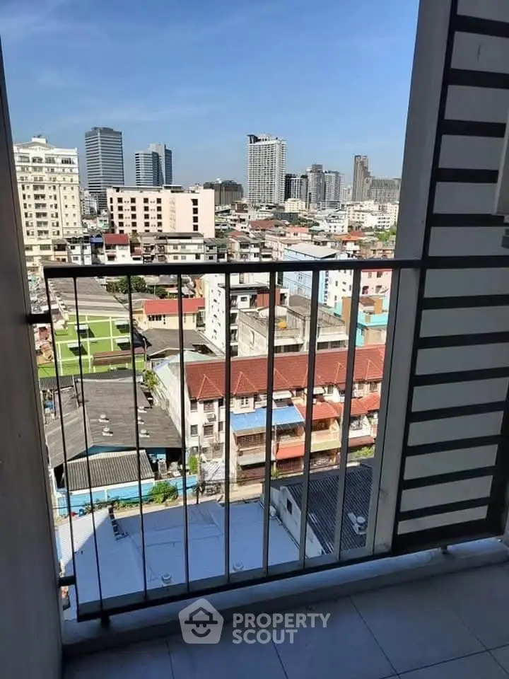 Stunning cityscape view from a high-rise balcony, perfect for urban living enthusiasts.