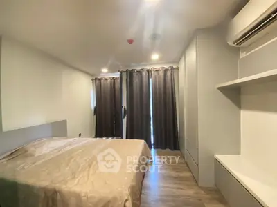 Spacious bedroom with modern decor and ample natural light