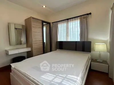 Cozy bedroom with modern furniture and ample natural light