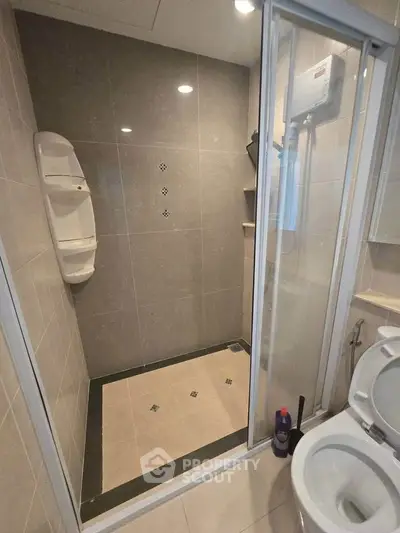 Modern bathroom with glass shower and sleek tile design