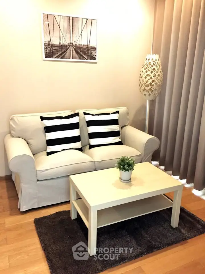 Cozy living room with stylish sofa, modern decor, and warm lighting