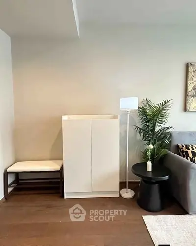 Modern living room corner with stylish furniture and decor