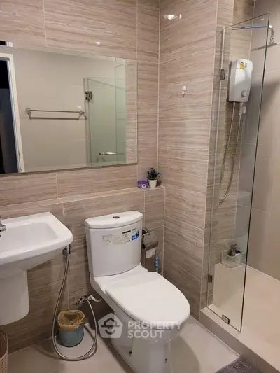 Modern bathroom with glass shower and sleek fixtures