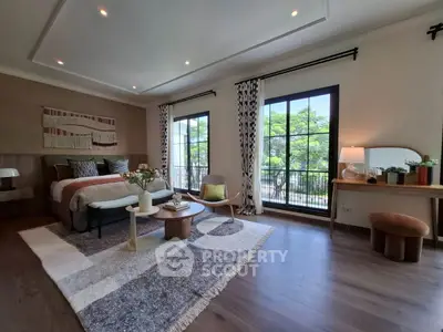 Spacious bedroom with large windows and stylish decor