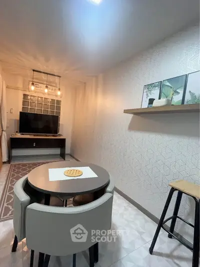 Modern living room with stylish decor and cozy dining area, perfect for urban living.