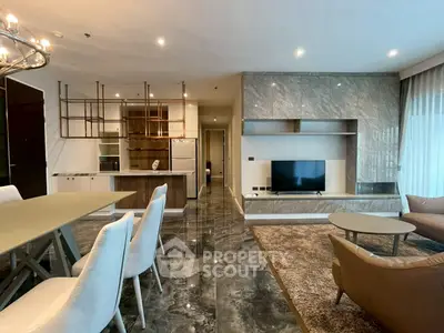 Luxurious modern living room with marble flooring and open kitchen layout
