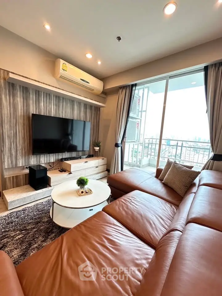 Luxurious living room with leather sofa and city view balcony in modern apartment.