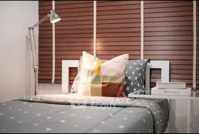 Cozy bedroom with modern decor and stylish bedding