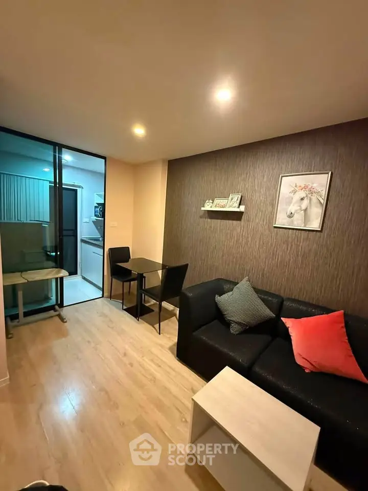 Modern living room with cozy seating and stylish decor in a contemporary apartment.