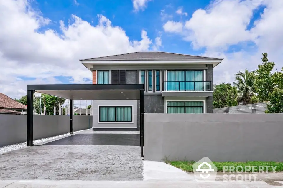 Modern two-story house with spacious driveway and sleek design