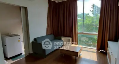 Cozy living room with natural light and modern furnishings