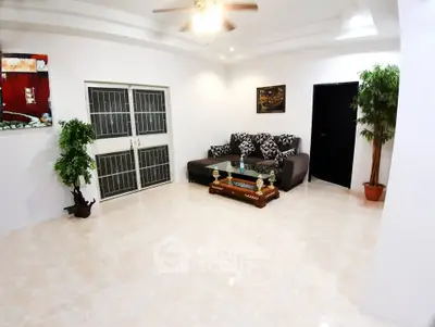 Spacious living room with modern decor and natural light