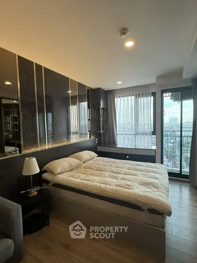 Luxurious bedroom with city view and elegant decor in modern apartment