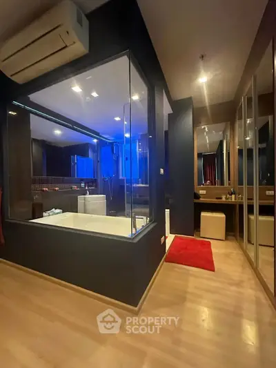 Luxurious modern bathroom with glass walls and ambient lighting