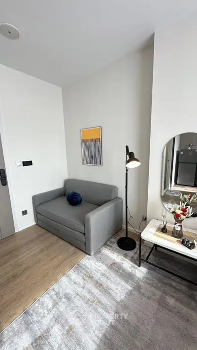 Modern living room with stylish gray sofa and elegant decor