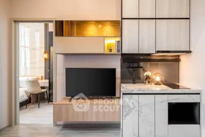 Modern open-plan living room with sleek kitchen and stylish decor