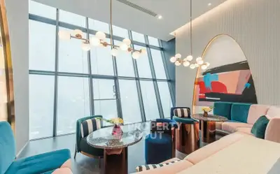 Luxurious modern living room with high ceilings and panoramic windows
