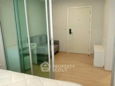 Modern apartment interior with sliding glass doors and minimalist furniture