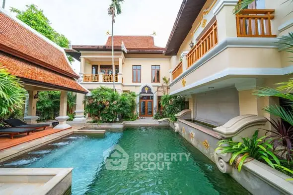 Luxurious villa with private pool and tropical garden, showcasing exquisite architecture and serene ambiance.