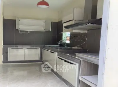 Modern kitchen with sleek cabinetry and open layout design