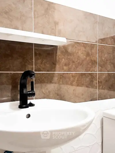 Modern bathroom with stylish sink and elegant tile design
