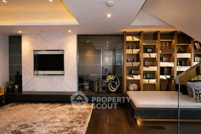 Luxurious modern living room with built-in bookshelf and cozy seating area