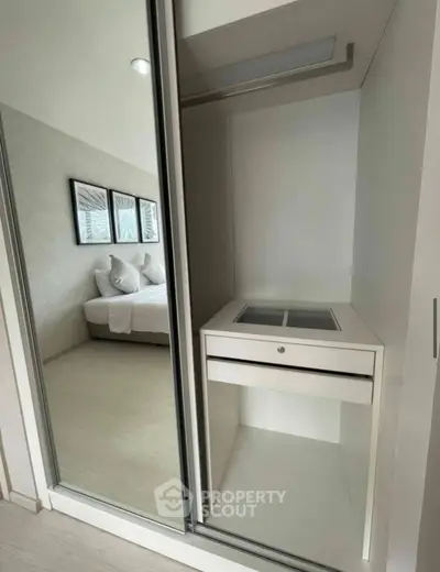 Modern bedroom with sleek built-in storage and elegant decor