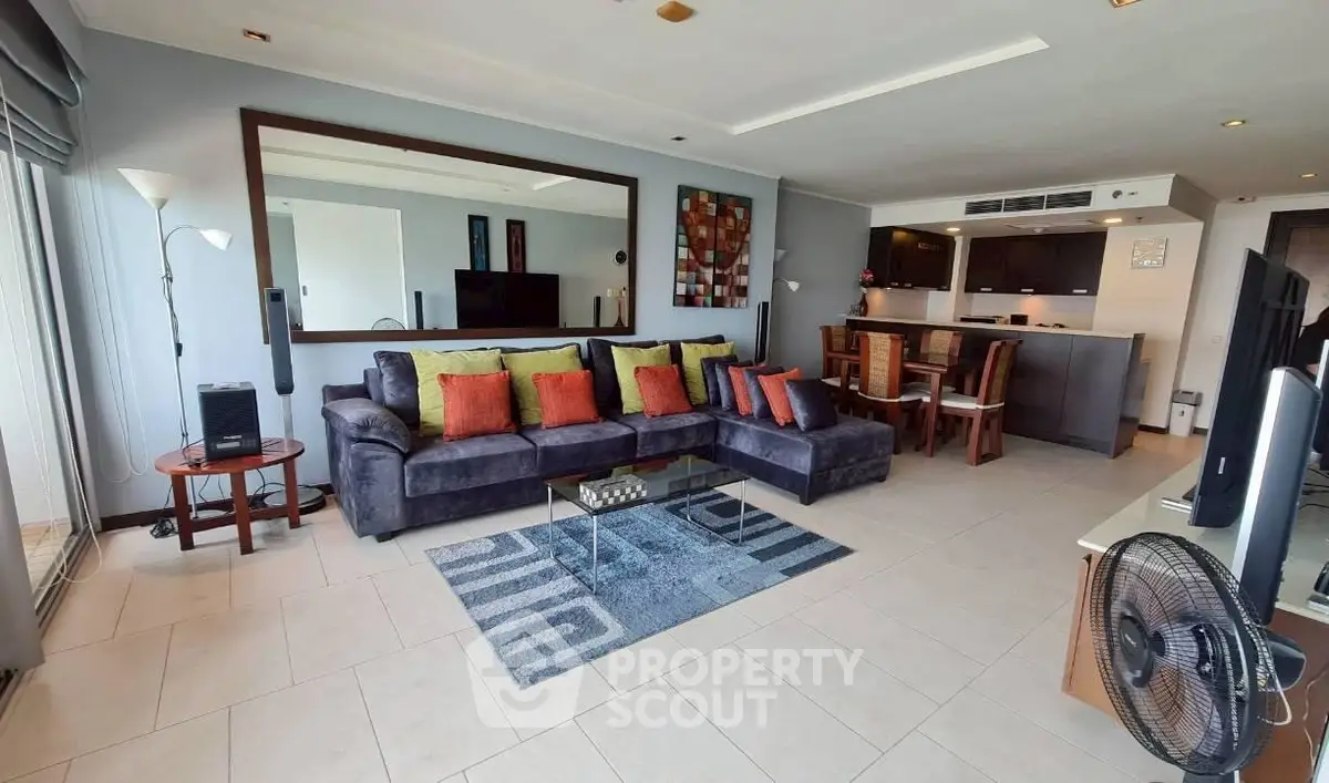 Spacious modern living room with stylish decor and open kitchen layout