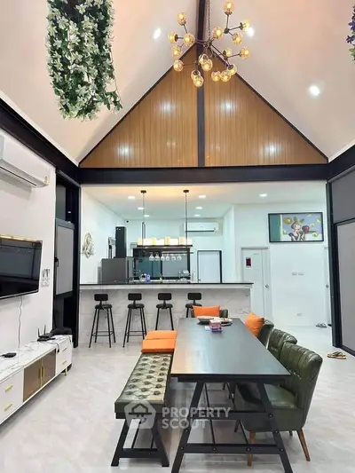 Stunning open-layout kitchen with high ceilings and modern decor