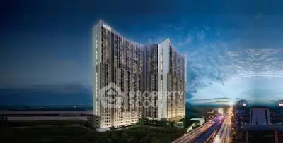 Stunning high-rise building with modern architecture and cityscape view at dusk.